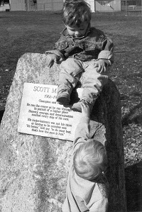 Two of Scott's three nephews play on the memorial rock placed at the starting line of the Paul Mariman Cross Country Course at Philomath High School.